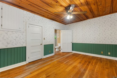 Hidden beneath towering hardwoods on a private wooded setting - photo 27