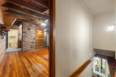 Hidden beneath towering hardwoods on a private wooded setting - photo 28