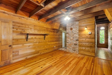 Hidden beneath towering hardwoods on a private wooded setting - photo 31