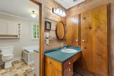 Hidden beneath towering hardwoods on a private wooded setting - photo 32