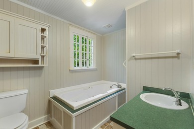 Hidden beneath towering hardwoods on a private wooded setting - photo 33