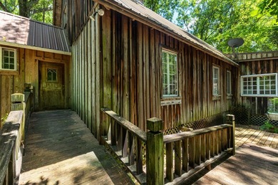 Hidden beneath towering hardwoods on a private wooded setting - photo 35