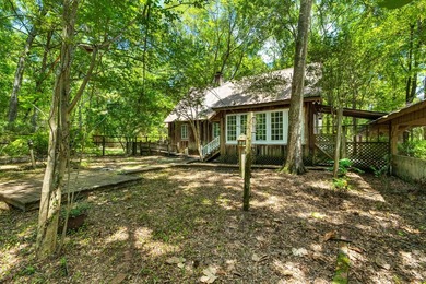 Hidden beneath towering hardwoods on a private wooded setting - photo 37