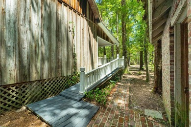 Hidden beneath towering hardwoods on a private wooded setting - photo 39