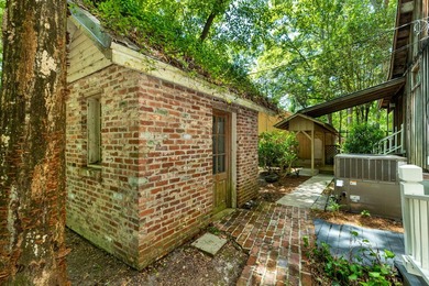 Hidden beneath towering hardwoods on a private wooded setting - photo 40