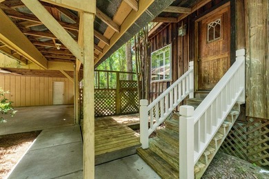 Hidden beneath towering hardwoods on a private wooded setting - photo 41