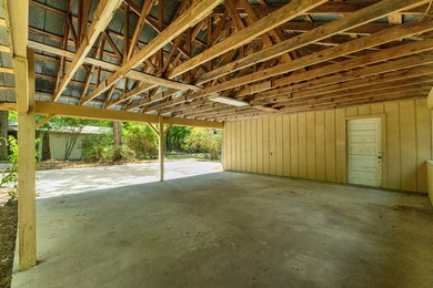 Hidden beneath towering hardwoods on a private wooded setting - photo 42