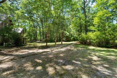 Hidden beneath towering hardwoods on a private wooded setting - photo 44
