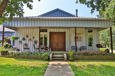 Enjoy quiet country living in this unique barndominium style - photo 6