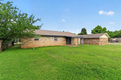 Welcome home to 811 Ridgeway Drive in Yukon! This charming - photo 32