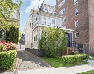 Presenting a beautifully renovated four-level, two-family - photo 2