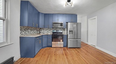 Presenting a beautifully renovated four-level, two-family - photo 6