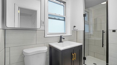 Presenting a beautifully renovated four-level, two-family - photo 10