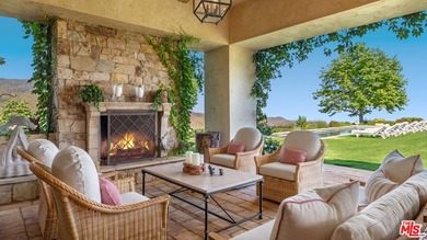 Tucked away behind gates atop the Malibu hills, this enchanting - photo 14