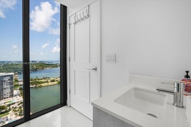 Welcome to One Paraiso #3306, a private elevatored 3 bed, 3.5