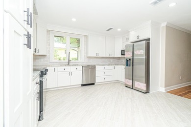 Completely renovated and move-in ready! This beautifully updated - photo 16