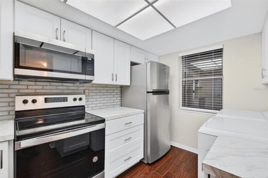 Welcome to easy first-floor living in this bright corner unit - photo 5