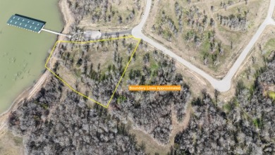 Pristine Waterfront 1+ Acre Lot in Gated Subdivision on RC Lake! - photo 2