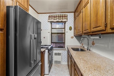 Welcome to 2465 Knapp Street #4F, a bright and beautifully lit