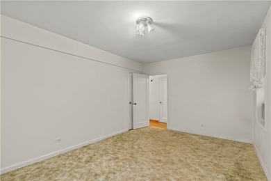 Welcome to 2465 Knapp Street #4F, a bright and beautifully lit