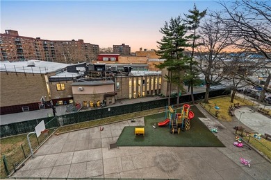 Welcome to 2465 Knapp Street #4F, a bright and beautifully lit