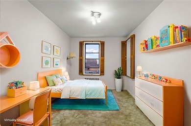 Welcome to 2465 Knapp Street #4F, a bright and beautifully lit