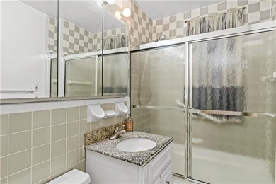 Welcome to 2465 Knapp Street #4F, a bright and beautifully lit