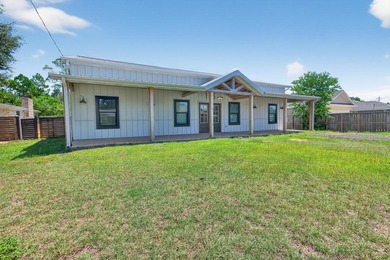 Built in 2023, this modern farmhouse offers a rare blend of - photo 2