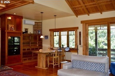Perched on 42 pristine acres overlooking the Rogue River, this - photo 9
