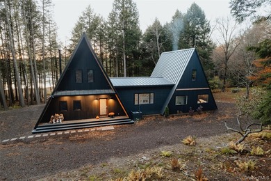 Escape to your own private woodland getaway in this striking - photo 2
