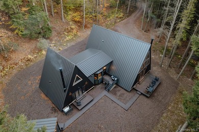 Escape to your own private woodland getaway in this striking - photo 3