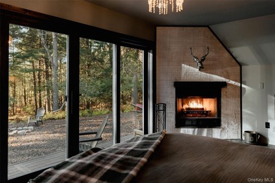 Escape to your own private woodland getaway in this striking - photo 7