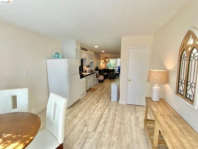 Townhome living on the golf course! Nestled within the gated