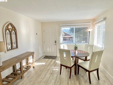 Townhome living on the golf course! Nestled within the gated