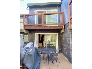 Townhome living on the golf course! Nestled within the gated