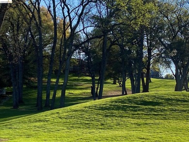 Townhome living on the golf course! Nestled within the gated