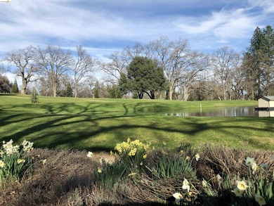 Townhome living on the golf course! Nestled within the gated