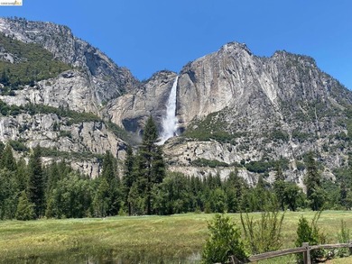 Townhome living on the golf course! Nestled within the gated