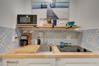 Only two blocks from the beach, this well established resort and - photo 27