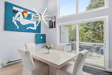 Light-filled and inviting, this upper-level residence at East - photo 5
