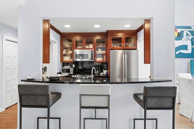 Light-filled and inviting, this upper-level residence at East - photo 6