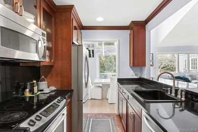 Light-filled and inviting, this upper-level residence at East - photo 7