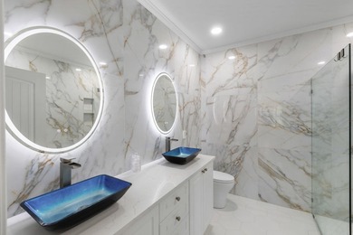 This completely renovated 3-bedroom, 3-bath, corner-unit - photo 16