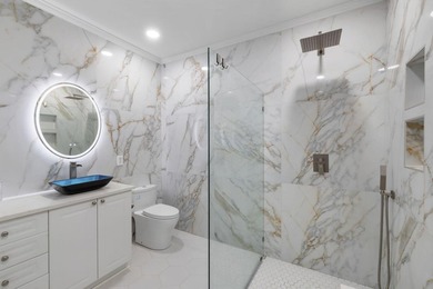 This completely renovated 3-bedroom, 3-bath, corner-unit - photo 17