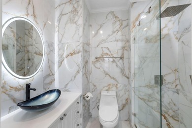 This completely renovated 3-bedroom, 3-bath, corner-unit - photo 19