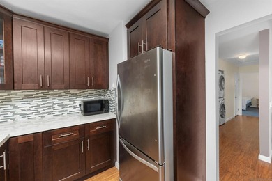 Welcome to this beautifully appointed top-floor residence in the - photo 11