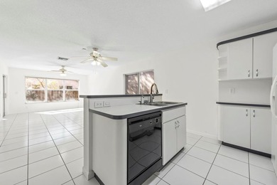 This light-filled home welcomes you into a spacious living room - photo 13