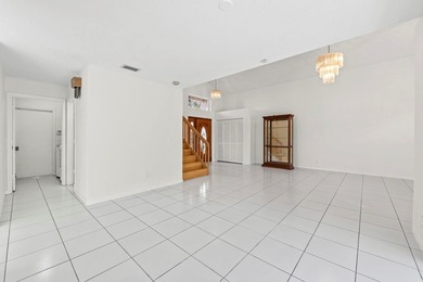 This light-filled home welcomes you into a spacious living room - photo 14