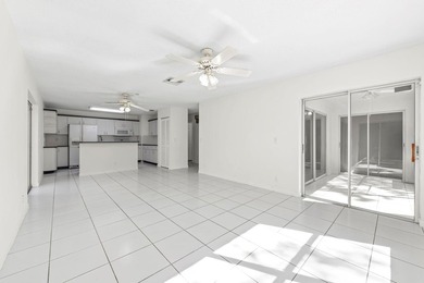 This light-filled home welcomes you into a spacious living room - photo 16
