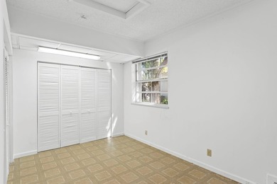 This light-filled home welcomes you into a spacious living room - photo 18